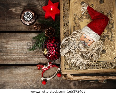 vintage christmas decoration with antique baubles and toys on wooden background. sentimental nostalgic retro style picture. dark designed, selective focus