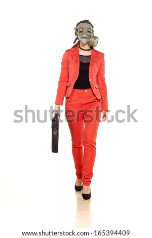 young business woman walking with a gas mask