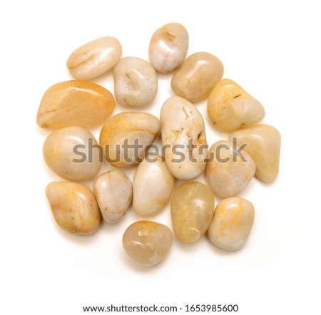 Pile yellow rocks isolated on white background, top view