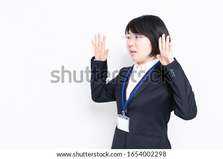 Surprised business woman photographed in the studio