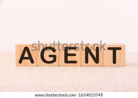 AGENT word made with building blocks on a light background
