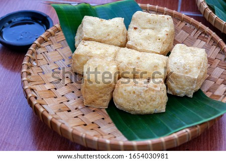 Tahu Sutra Gorang, Indonesian local food called Tahu Crispy, which is crispy fried tofus served with chilli sauce Royalty-Free Stock Photo #1654030981