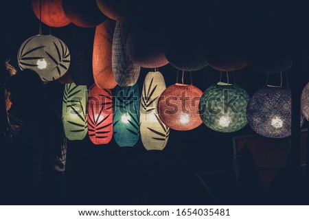 Beautiful Lao silk lanterns in the night market of Luang Prabang in Laos during the Bon Ok Pansa or Light Festival
