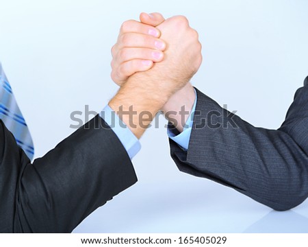 Arm wrestling: business concept isolated on white
