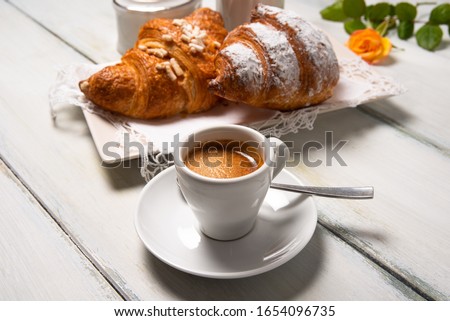 Cup of italian espresso and brioches Royalty-Free Stock Photo #1654096735