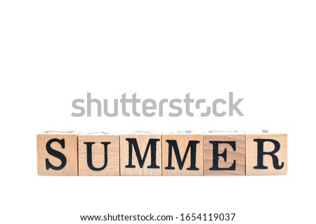 Wooden cube block arrange to summer word for children education, summer season for relaxation.