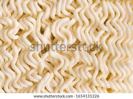Top view close up of instant noodles texture background. Selective focus. tasty dry fastfood traditional asian meal.