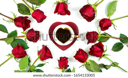 Red roses creative composition flat lay layout with coffee in heart shaped cup and saucer on white background.