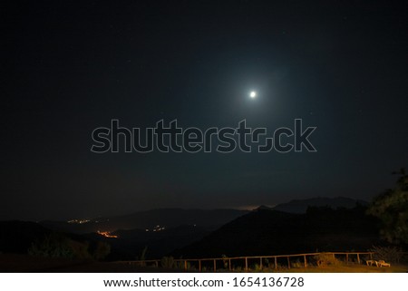 Panoramic night view with the moon.