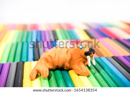 Play clay Animals. Walrus on colored background.