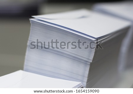 a pile of paper envelopes in printing office Royalty-Free Stock Photo #1654159090