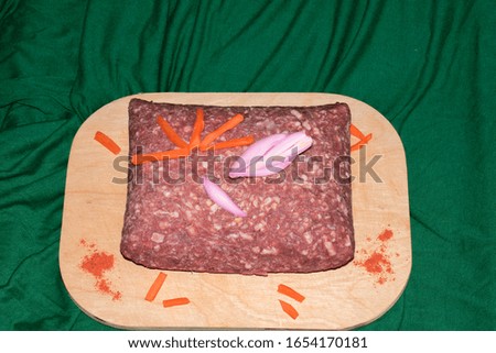 Fresh raw minced meat, minced pork, minced meat with vegetables and spices.