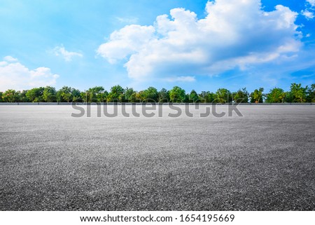 Empty asphalt road and woods background landscape Royalty-Free Stock Photo #1654195669