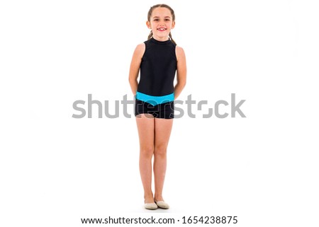 Girl child practice and doing rhythmic gymnastics portrait, white background. Young girl is dancing and having fun performing rhythmic gymnastics exercises. Isolated on white background.