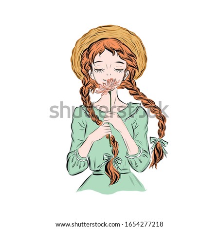 Girl in straw hat with two pigtails sniffs  flower.