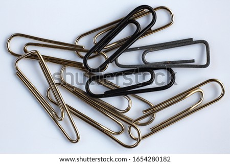 Paper clips on white acrylic background, Close up & Macro shot, Business, Education, Stationery concept