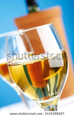 White wine with cooler in background