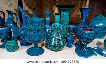 Colorful Turkish traditional ceramic handycrafts in a local pottery shop in Cappadocia Royalty-Free Stock Photo #1654297690