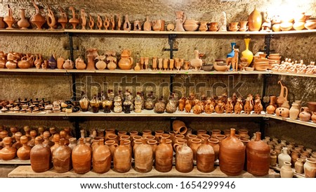 Rustic handmade brown terracotta vases and cups at the pottery shop in Avanos, Cappadocia, Turkey Royalty-Free Stock Photo #1654299946
