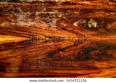 Wooden texture surface background. Vintage beaten and scratched mahogany countertop. Old used redwood furniture with peeling lacquer. 