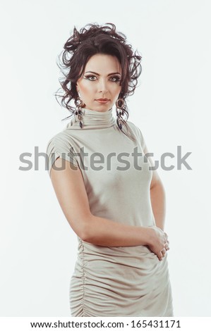 Cute woman with dark  hair looking into the camera