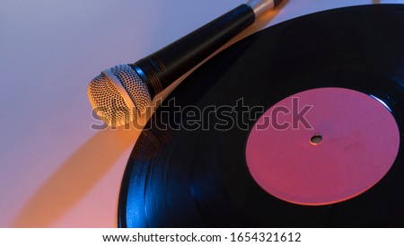 a microphone and vinyl record