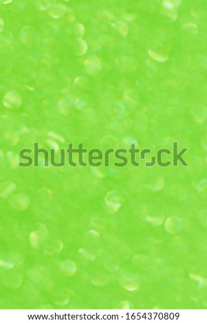 Green glitter. Silver and white glitter light bokeh abstract textured for background. glitter pattern designs white. Silver sparkle Wallpaper for Christmas. Grunge texture.
