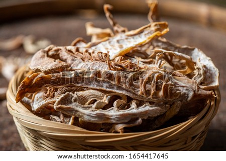 Dried bamboo shoots on a dark background.