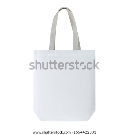 White colour fashion canvas recycled tote bag with cotton woven handle. Match with casual outfit. Suit for shopping & gathering, groceries and even as a gift. Design Template for Mock-up, advertising. Royalty-Free Stock Photo #1654422331