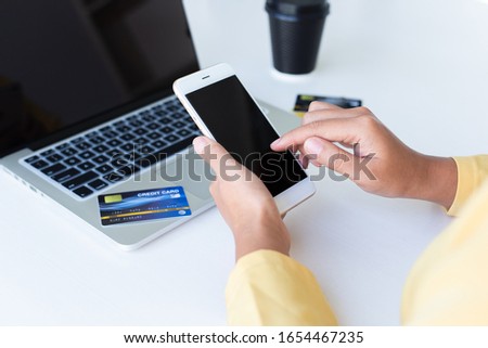 Women use mobile register via credit cards to make online purchases, Online shopping concept.