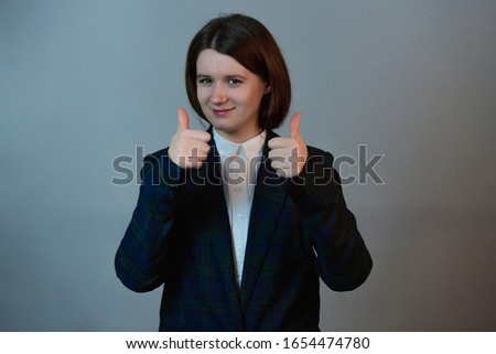 Confident and determined businesswoman positive face expression with  thumbs up . Personal development and motivation concept.