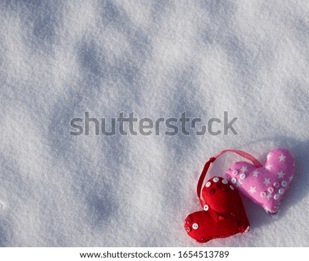 Image of soft toys in the snow. Handmade.