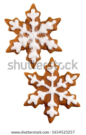 Iced snowflake cookies on white background