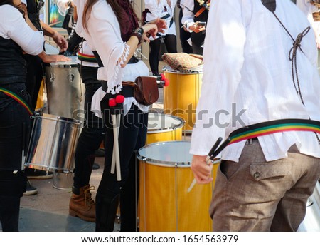 Close up of samba drum musicians at a street party carnival