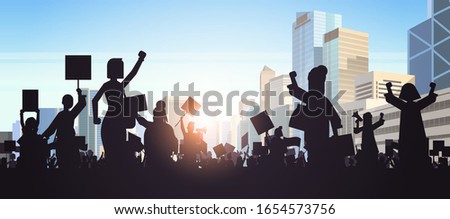 silhouette of people crowd protesters holding protest posters men women with blank vote placards demonstration speech political freedom concept cityscape background horizontal portrait vector