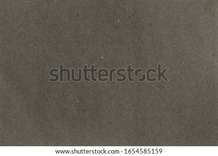 Kraft paper texture. Vintage gray black sheet of paper. Copy space