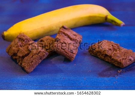 image of healthy and unhealthy snacks banana and brownie scene two very different food options