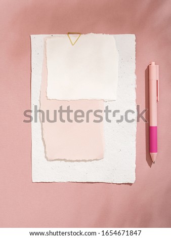 White empty handcrafted paper card. Shadowed card stylish mockup on pink background. To do list, greeting card, invitation or writing a letter concept.