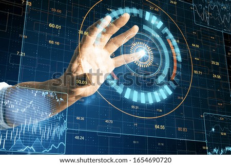 Businessman hand using digital screen with business charts and stock analysis. Global business and media concept.