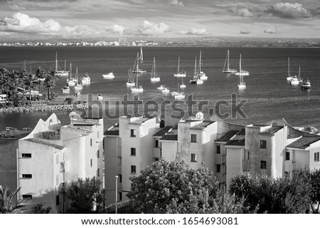 Black and white picture of Port of Alcudia, main tourist center in the North of Majorca, Spain.