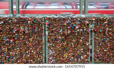 Love padlocks on Hohenzollern Bridge at Cologne in Germany. 