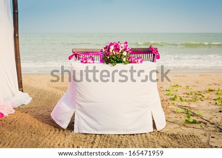 Table on the beach with wedding decoration