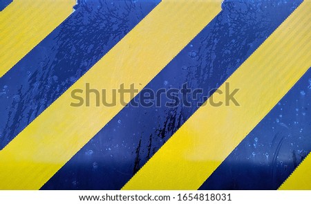 yellow and black stripes sign closeup photo