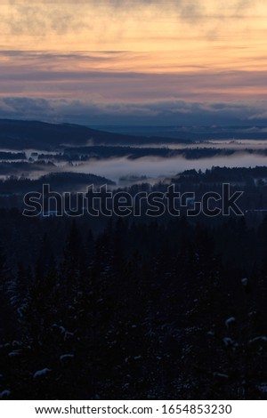 Mighty view over cloudy valleys in sunset in Västerbotten Norrland Sweden.