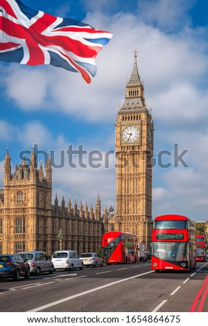 London with red buses against Big Ben in England, UK Royalty-Free Stock Photo #1654864675