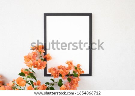 Black frame poster with bougainvillea tree and colorful flowers. Home decoration or summer  concept