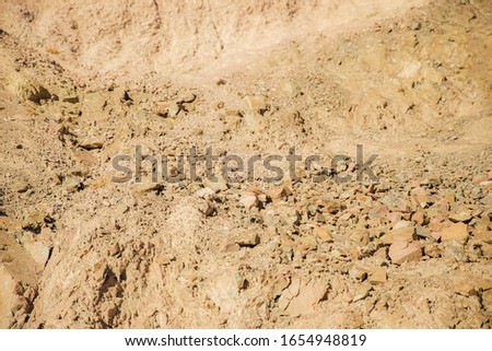 Texture. The fragments of the rocks of sandstone. Abstract background.