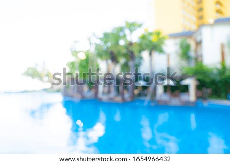 Abstract blur and defocus outdoor swimming pool in hotel resort for travel and vacation background