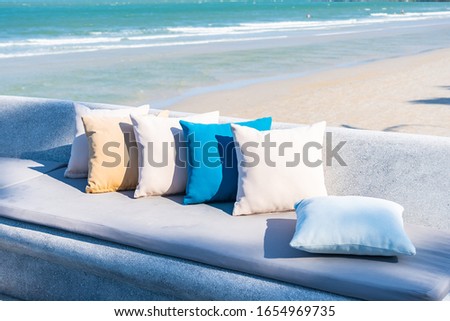 Pillow on chair or sofa lounge around outdoor patio with sea ocean beach view for travel
