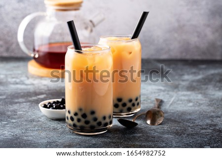 Milk bubble tea with tapioca pearls and honey